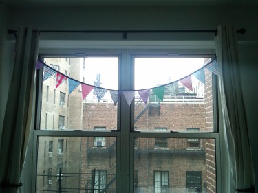 Nautical flags in JR's bedroom window